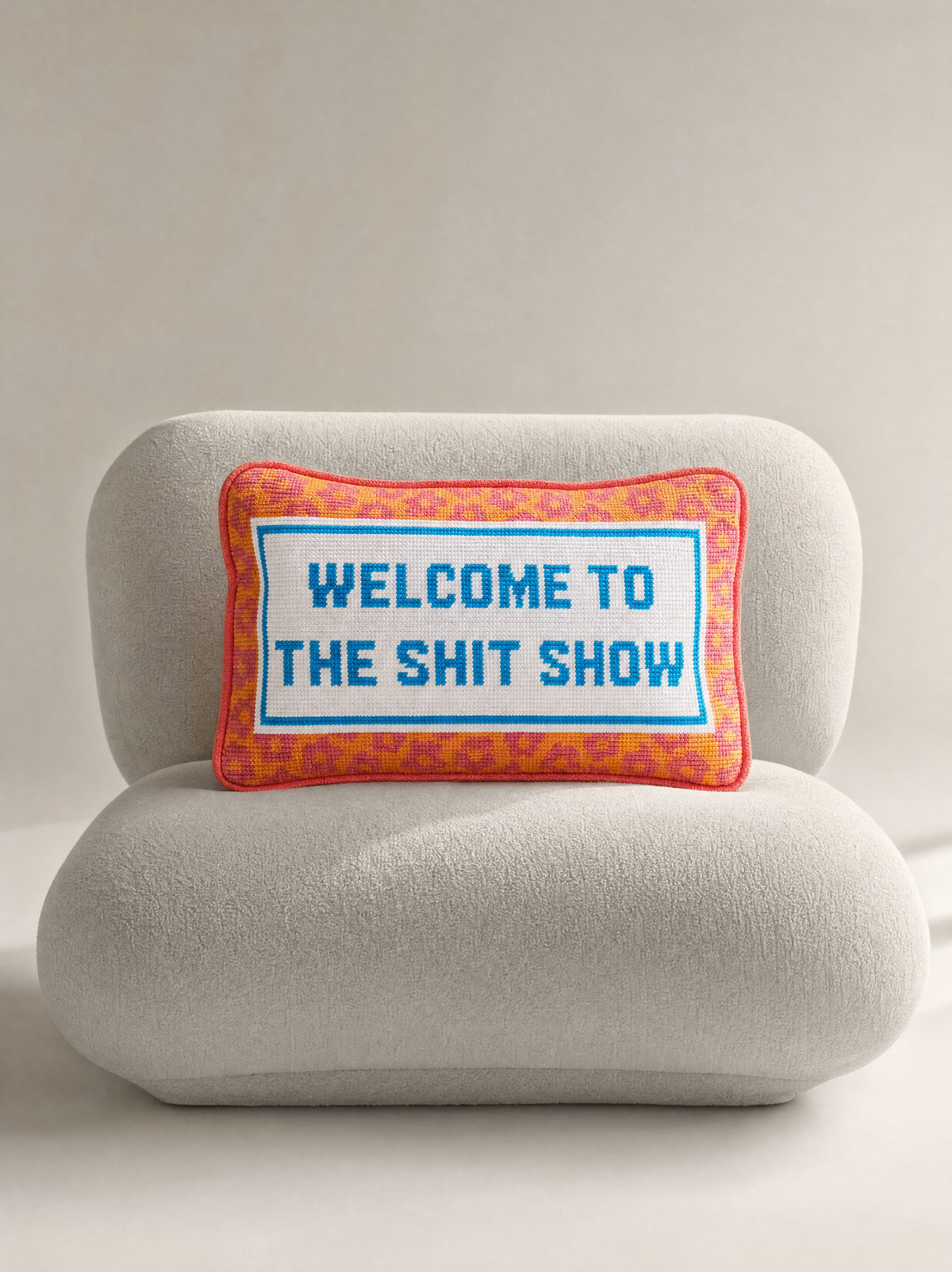 Lumina & Co. Playful Pillows collection campaign image featuring the Welcome To The Shit Show Pillow